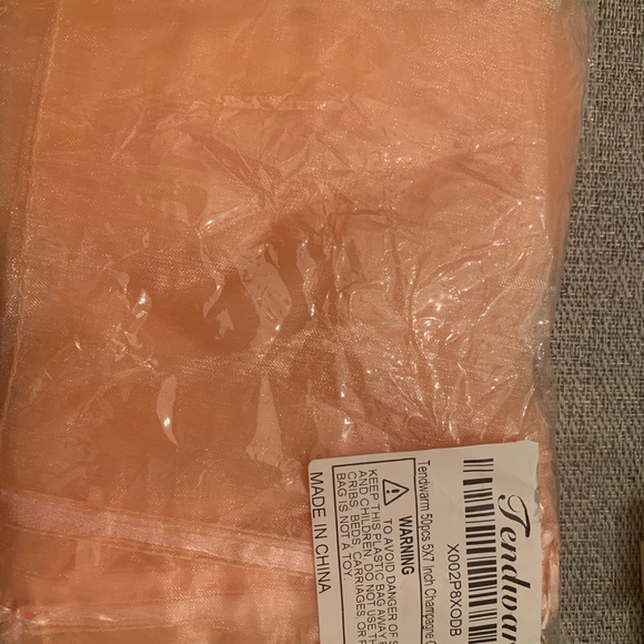 Light peach 5x7 organza bags. Says champagne color - it’s a light peach. - Picture 5 of 5
